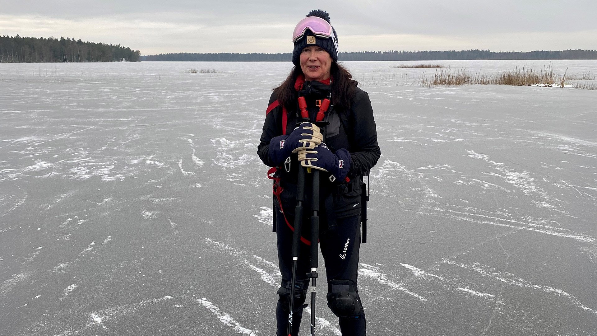 Business development director Päivi Leppänen on lake ice in skating gear